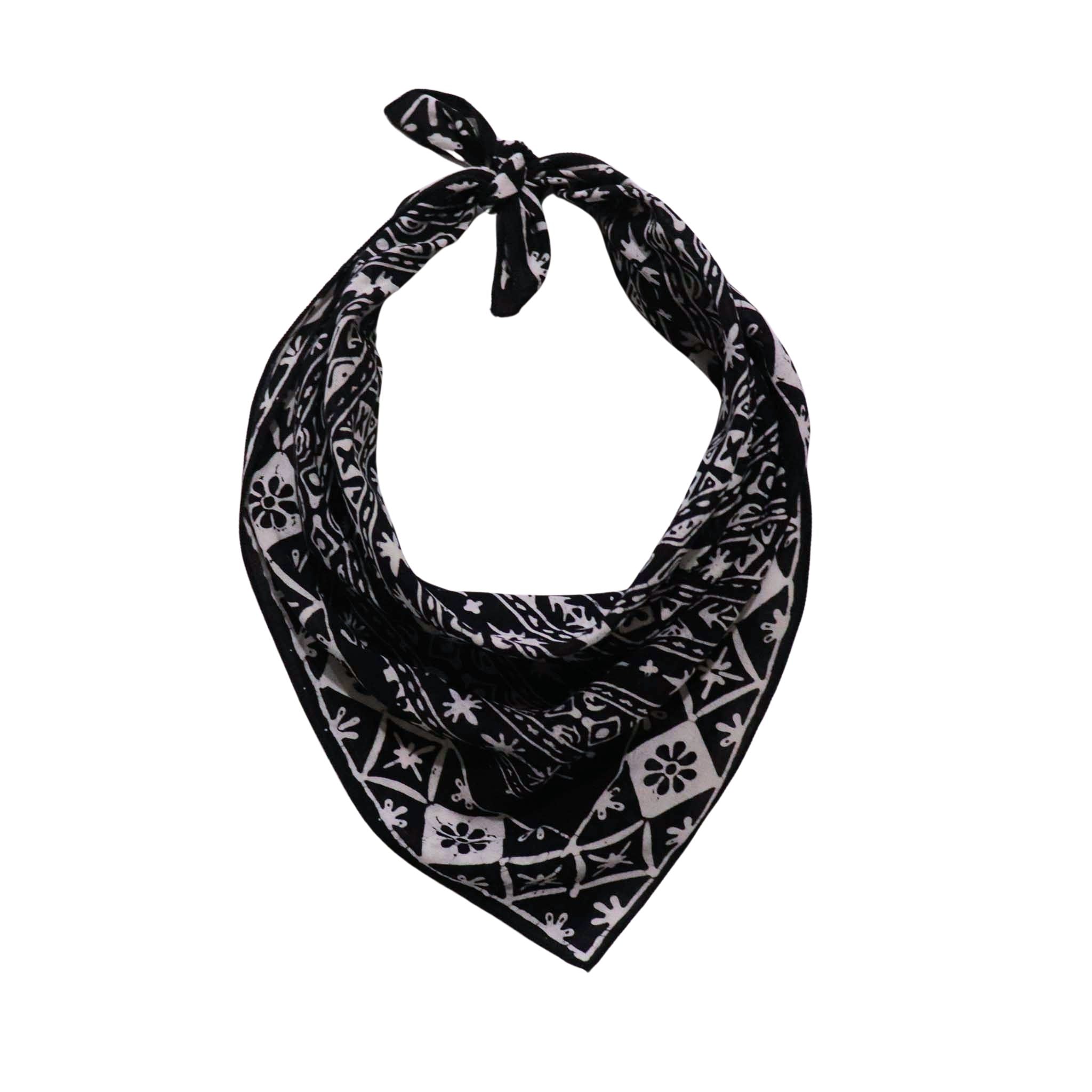Black and white patterned 100% cotton bandana with a Kasih Co-op logo on a white background