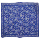 A large 39-inch hand-dyed blue batik bandana with a floral pattern laid out flat.