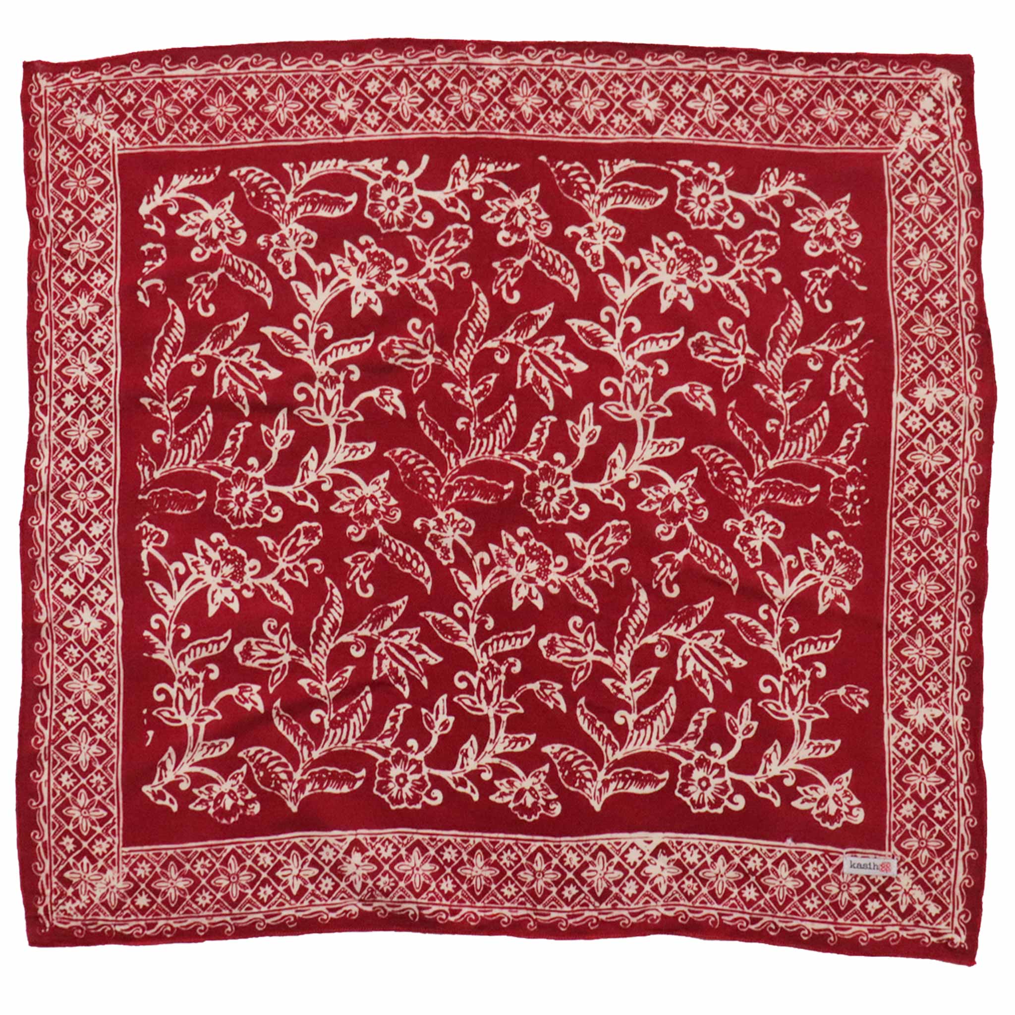 Red bandana with white floral patterns on a white background