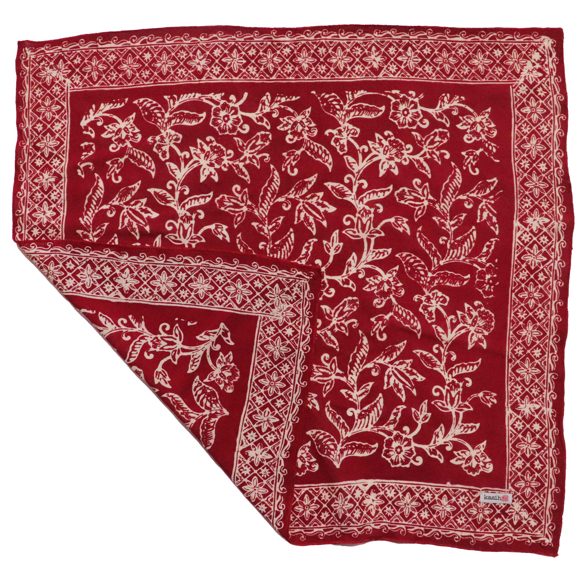 Red bandana with white floral patterns on a white background