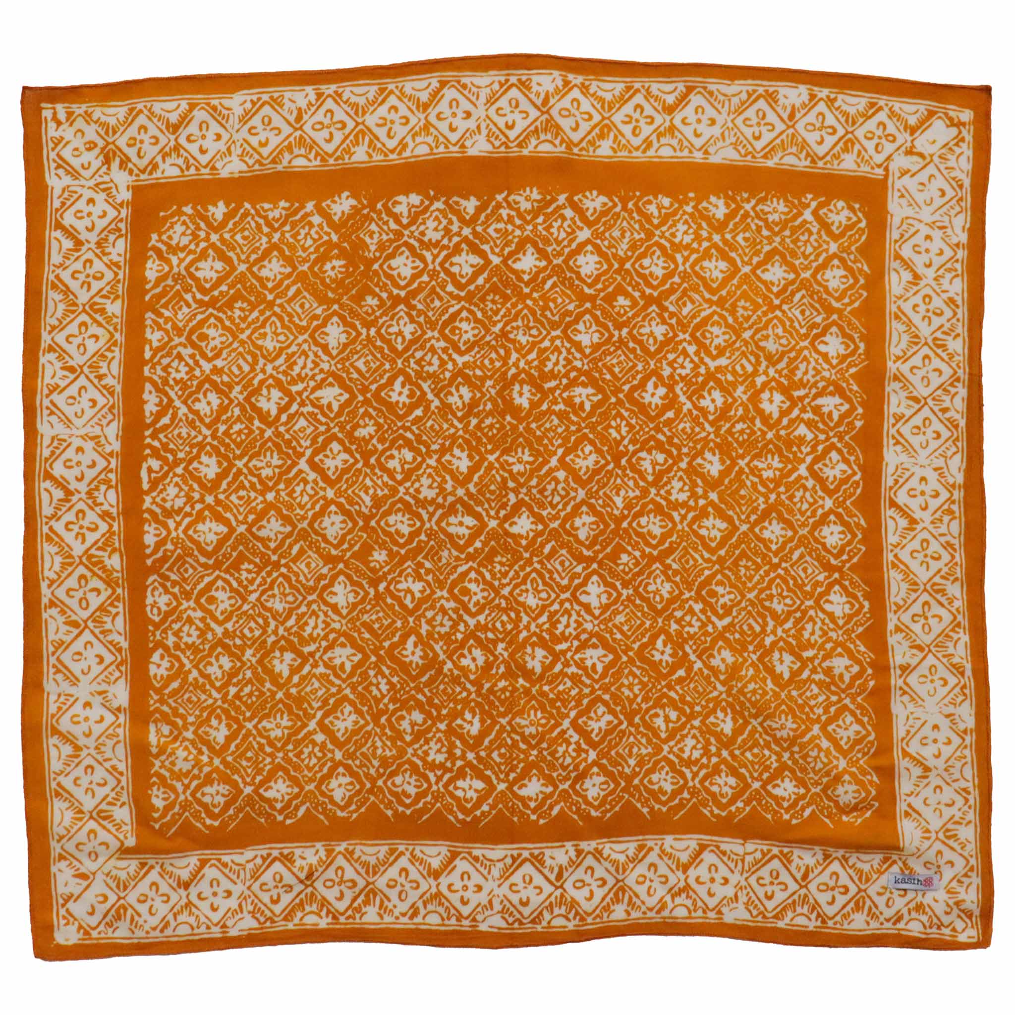 Tan cream light brown cotton batik bandana with white intricate patterns on a white background