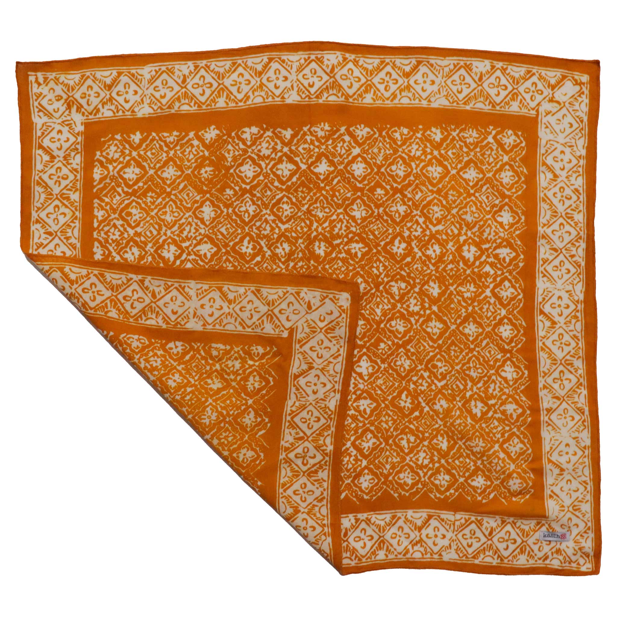 Tan and Mustard Brown and white patterned fabric on a white background