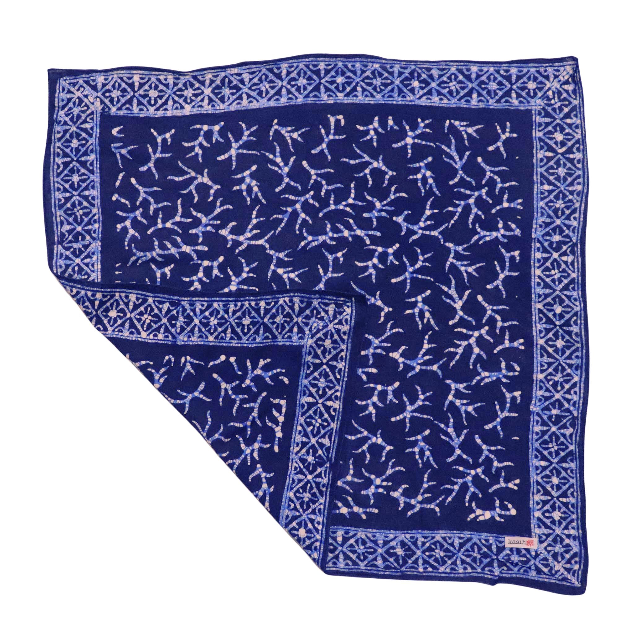 Navy blue cotton batik bandana with white pattern on a white background