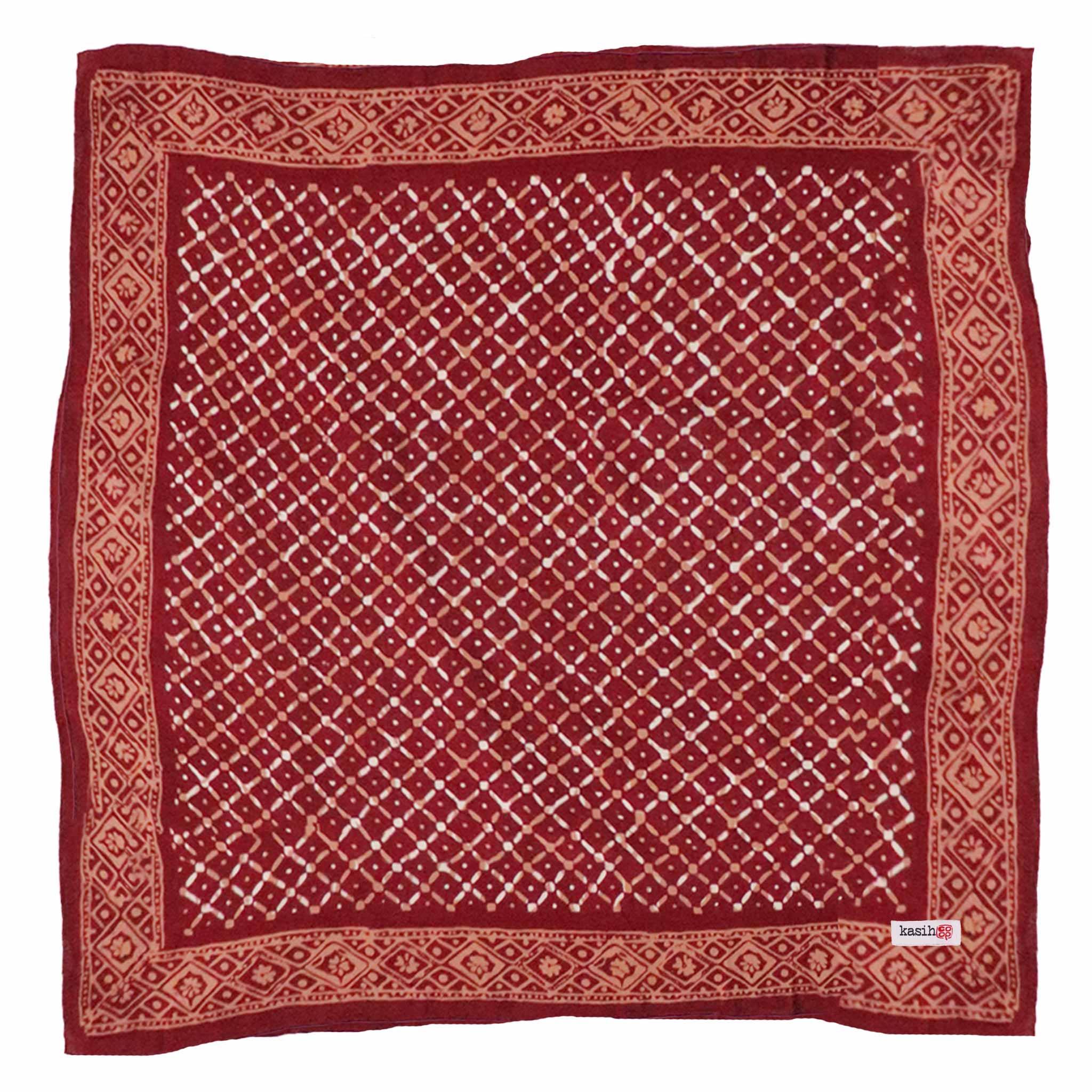 Red patterned cotton batik bandana with a lattice design on a white background