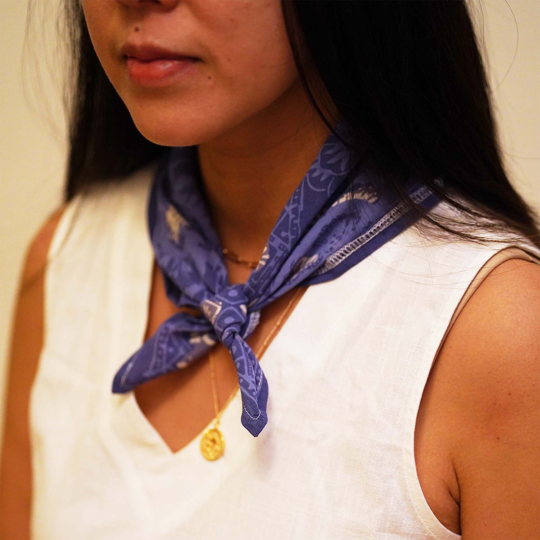 a woman wearing blue bandana batik