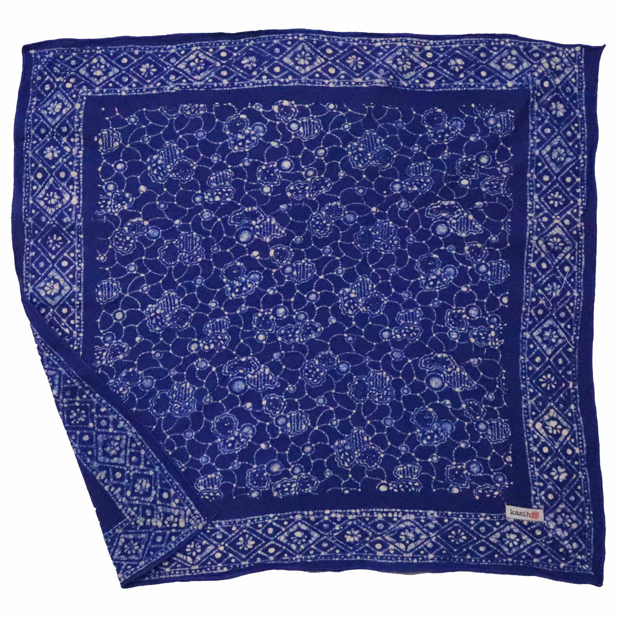 Blue bandana with white pattern on a white background