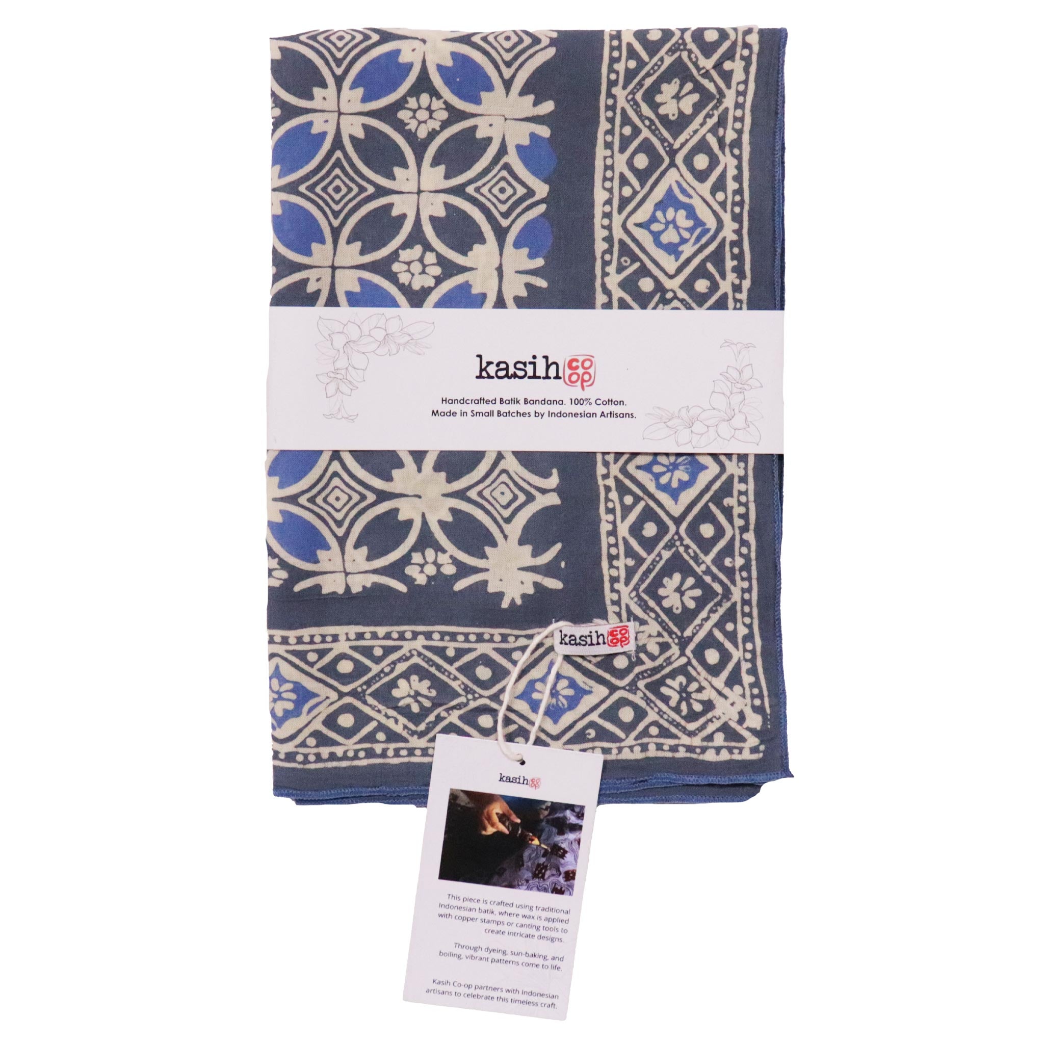 Blue and white patterned folded batik bandana with 'kasih' branding on a white background