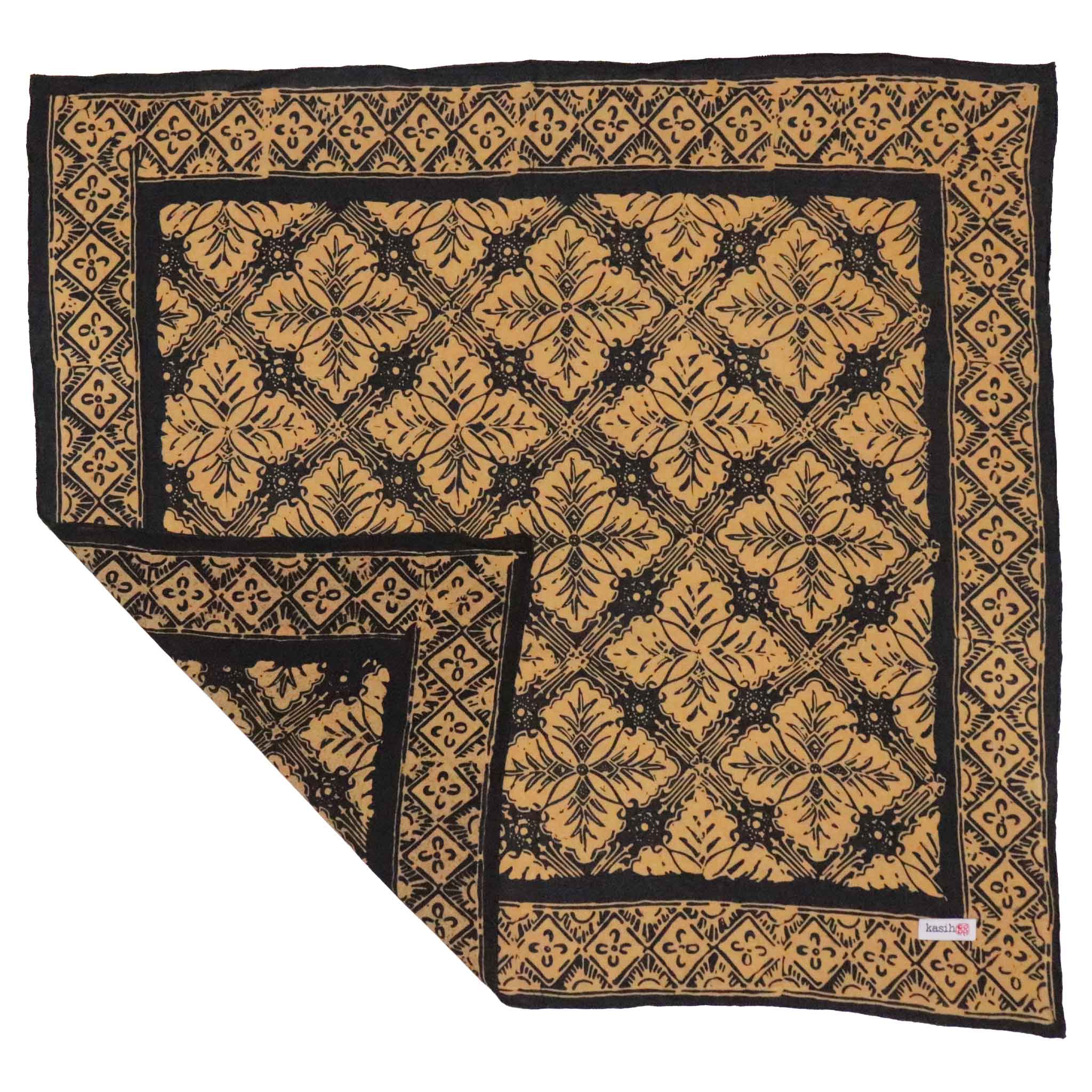 Patterned cotton batik bandana with black and gold design on a white background