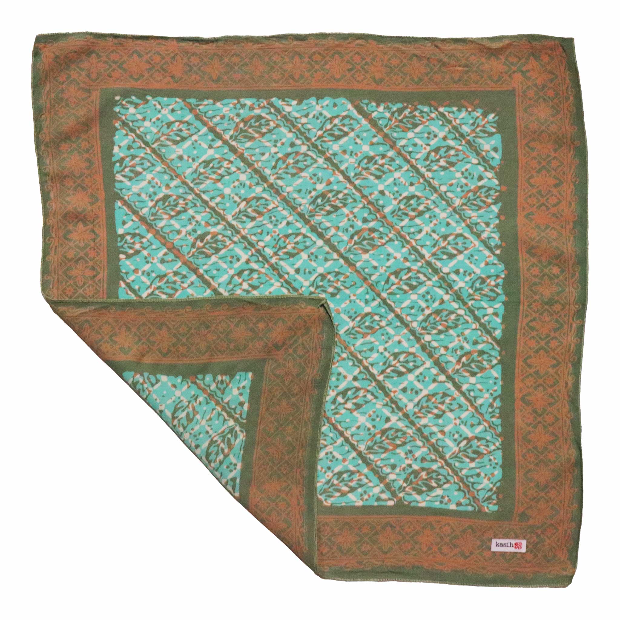 Folded cotton batik bandana dual sided double printed with green and brown pattern on a white background