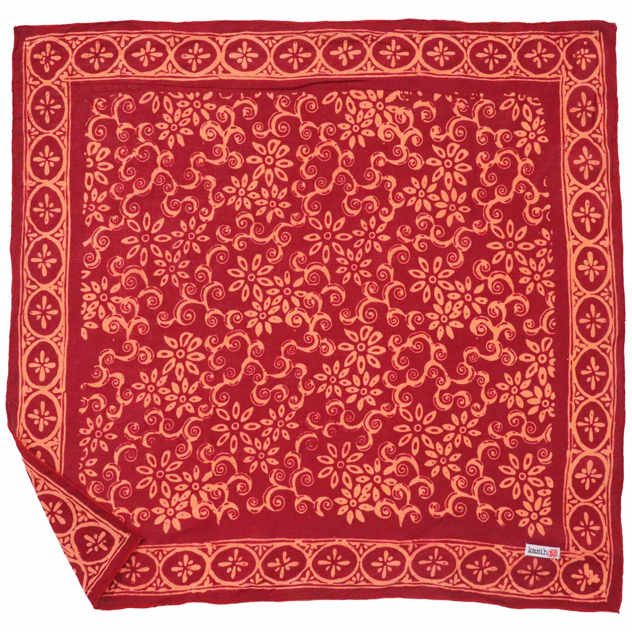 Red bandana with intricate orange patterns on a white background