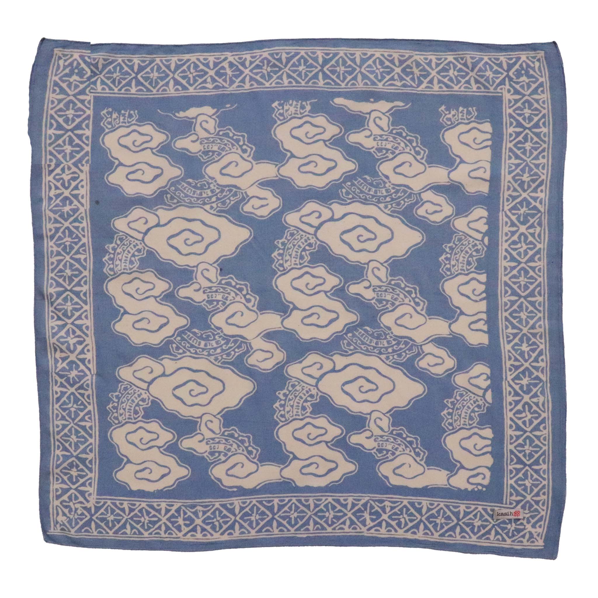 Blue bandana with white geometric pattern on a white background
