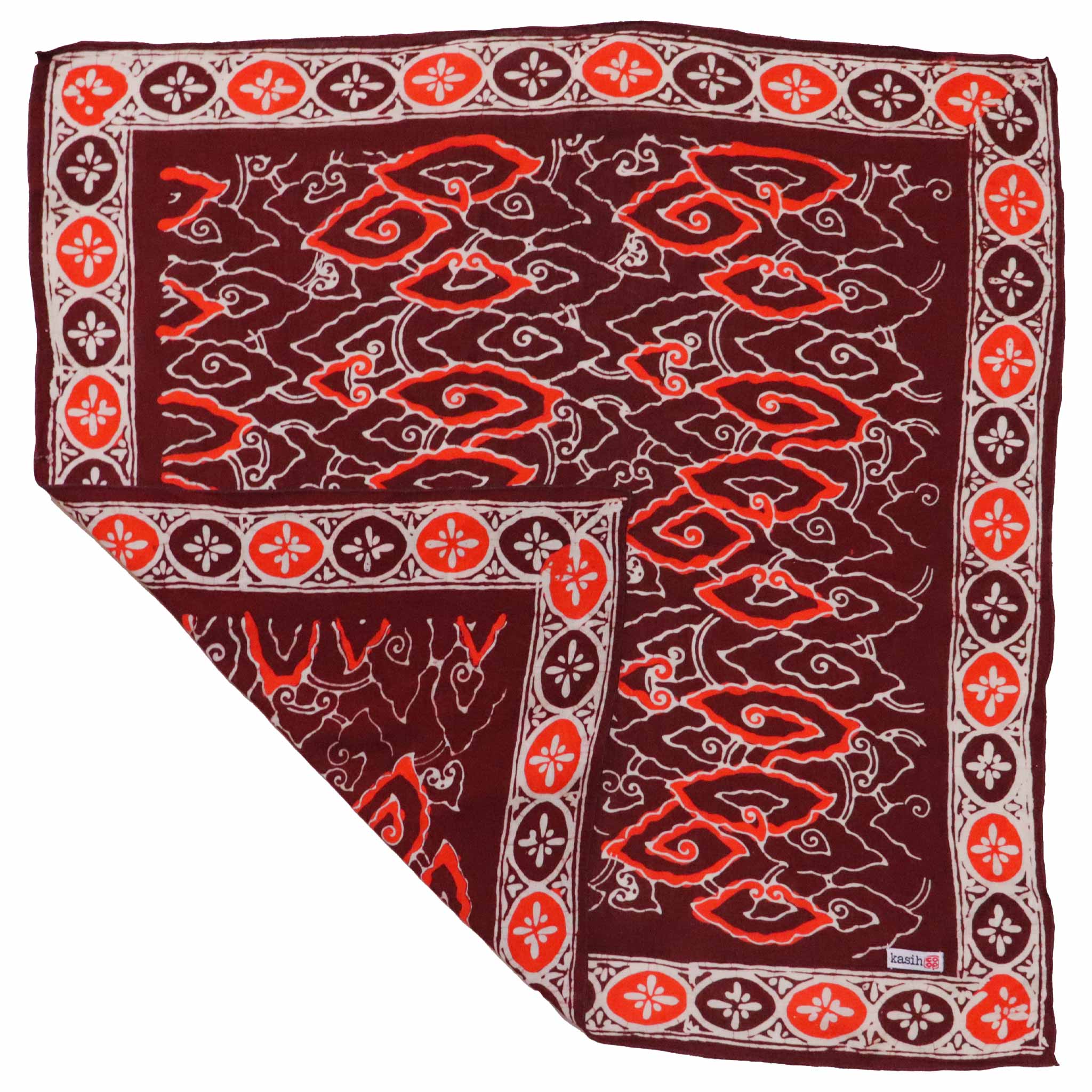 Folded dual sided double printed cotton bandana with red and white pattern on a white background
