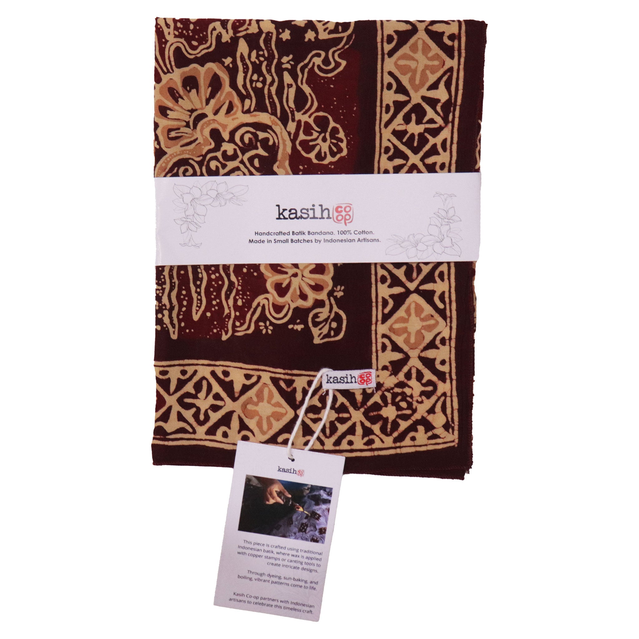 Folded batik bandana with intricate patterns and 'kasih' branding on a white background