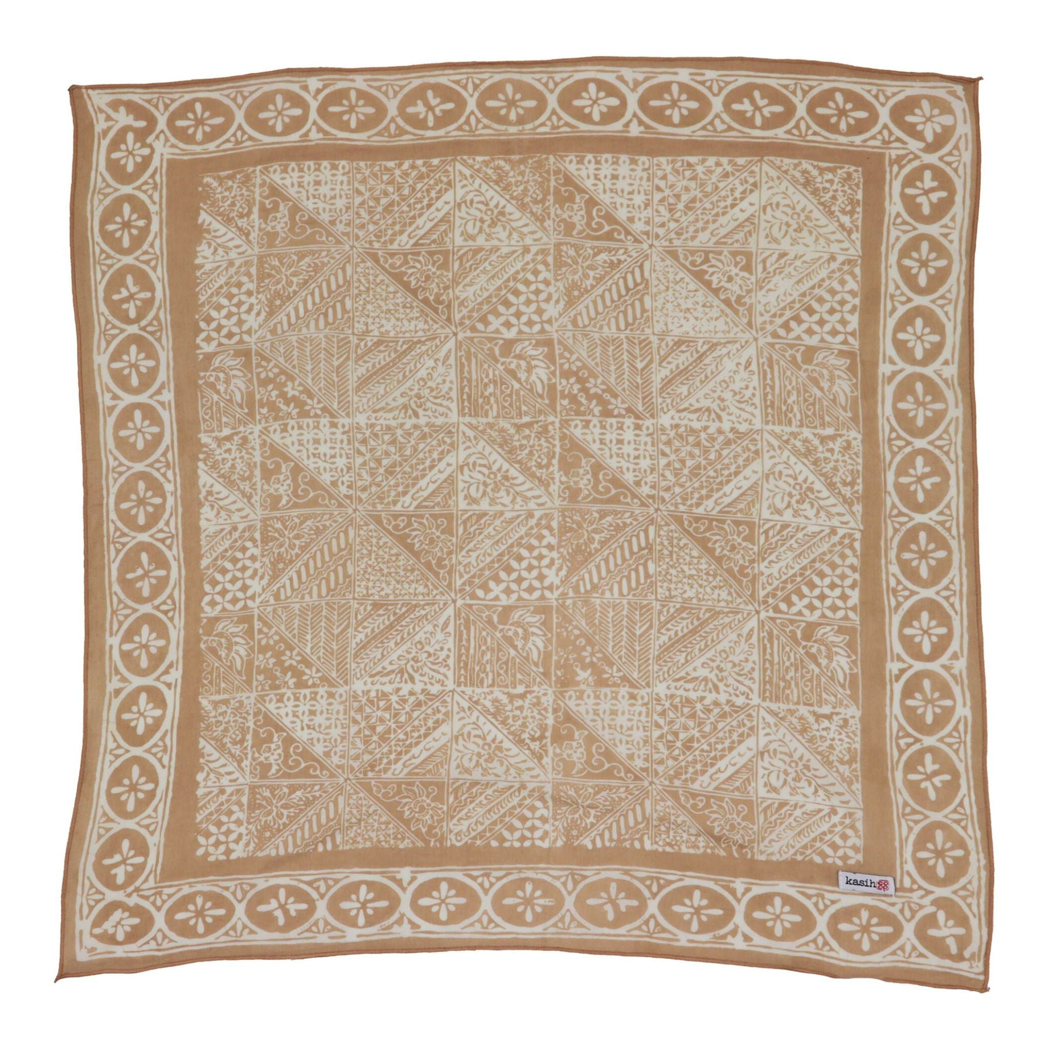 Beige and white patterned batik bandana square on a white background