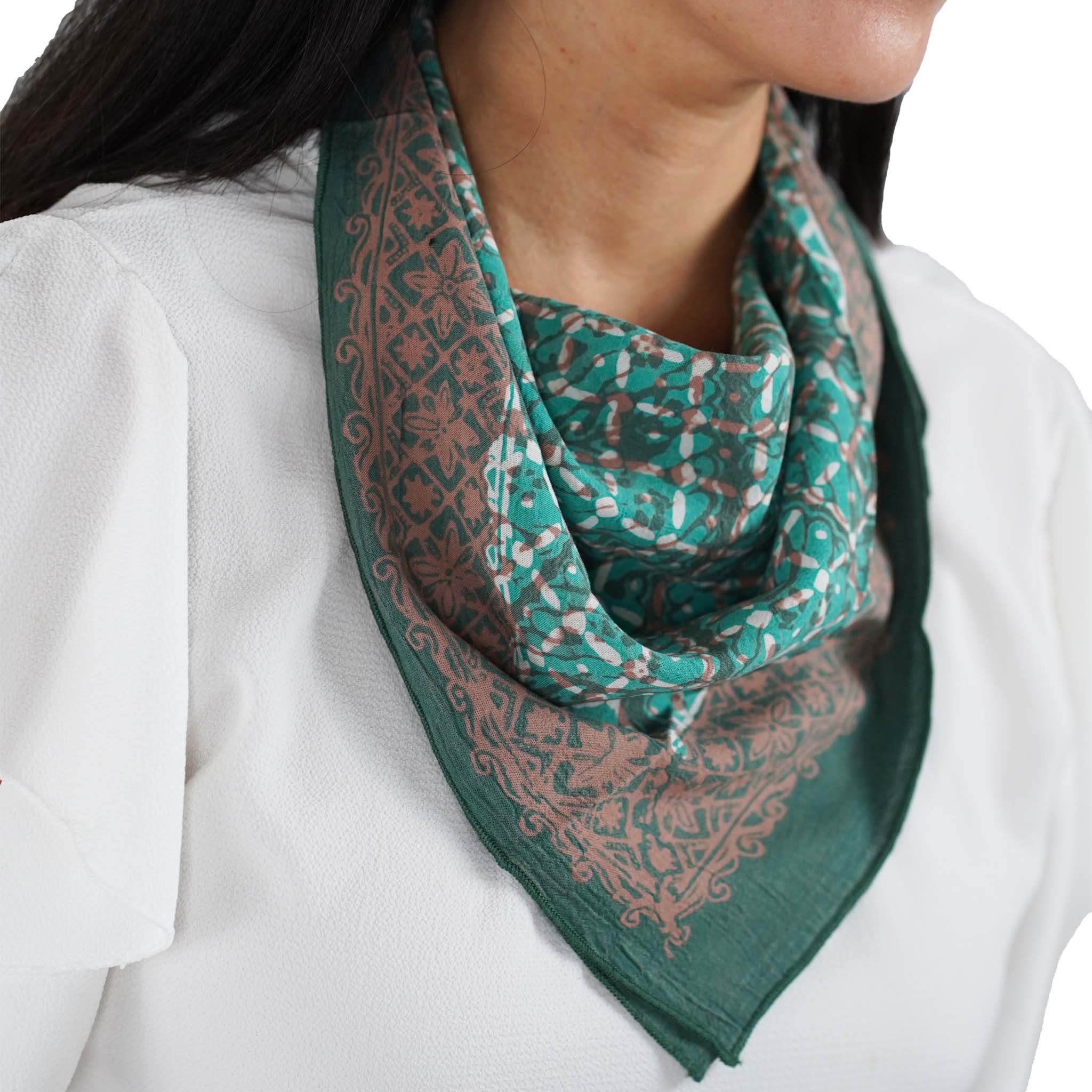 Cotton batik bandana with a patterned bandana-style scarf on a white background worn by a person