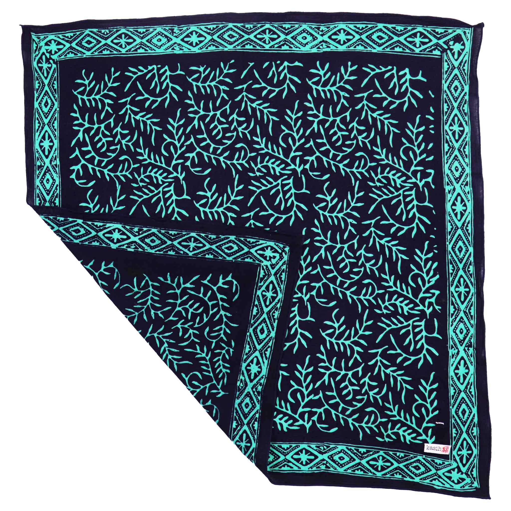 Teal and black patterned batik bandana on a white background