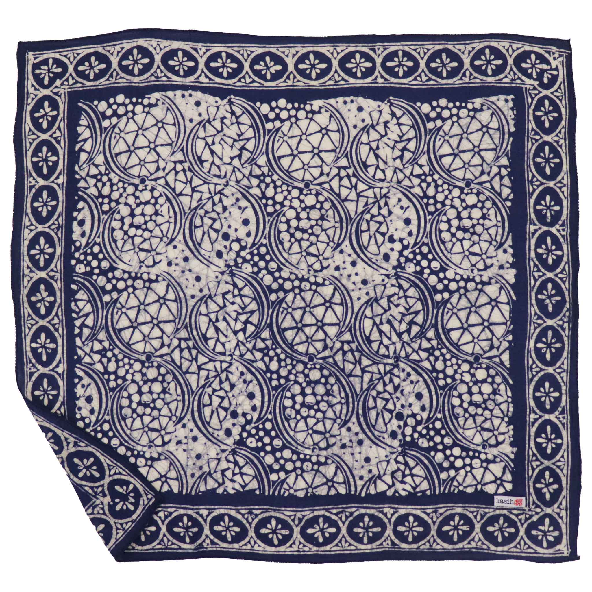 Kasih Co-op square batik bandana in Blue Stone pattern next to a long batik scarf