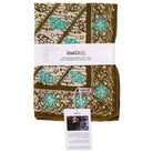 Folded fabric with green and brown pattern and 'kashi' branding on a white background