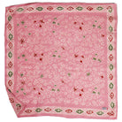 Pink bandana with floral and geometric patterns on a white background