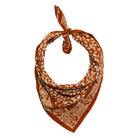 Yellow bandana with white patterns on a white background