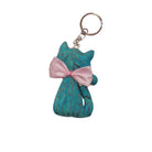 Teal cat-shaped keychain with a pink bow on a white background