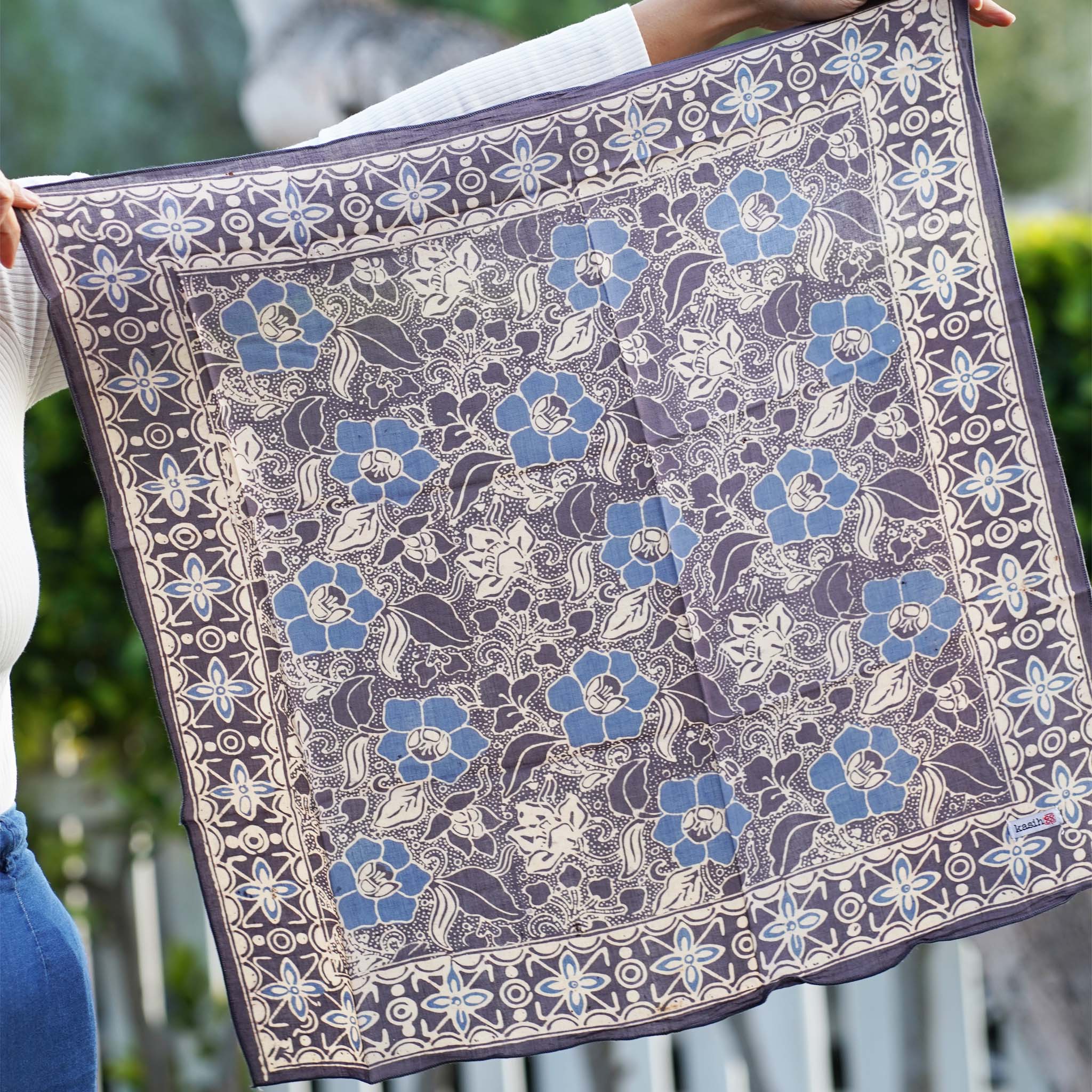 Decorative cotton batik bandana kasih co-op with floral pattern on a white background